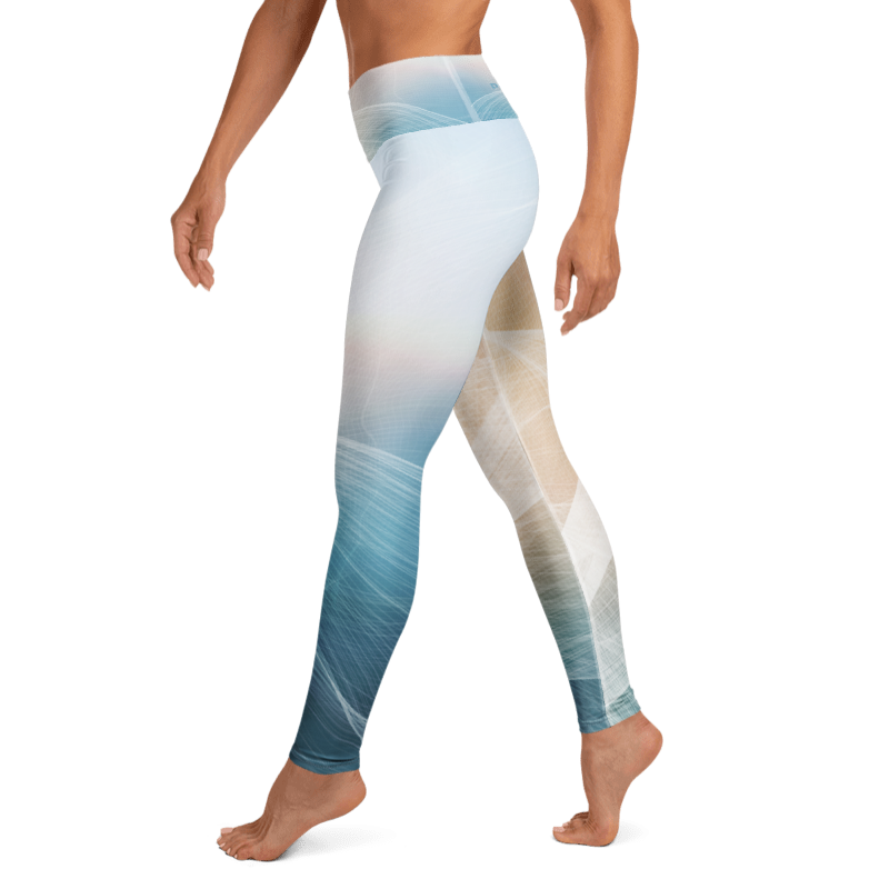 A model wearing high-waisted leggings with a blue, beige, and white abstract gradient pattern, shown from the waist down against a plain white background.