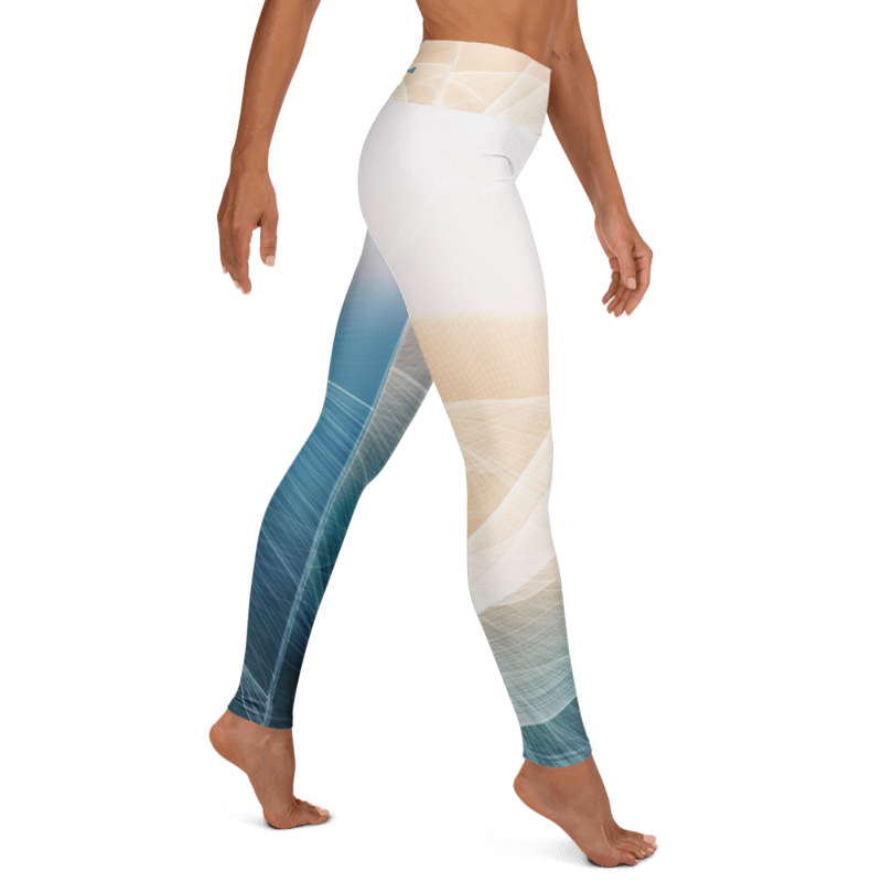 A model wearing high-waisted leggings with a geometric abstract pattern in shades of blue, beige, and white, shown from the waist down against a plain white background.