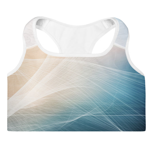 A racerback sports bra with a white mesh back and a front panel featuring an abstract design of flowing white lines over a gradient background transitioning from beige to blue.