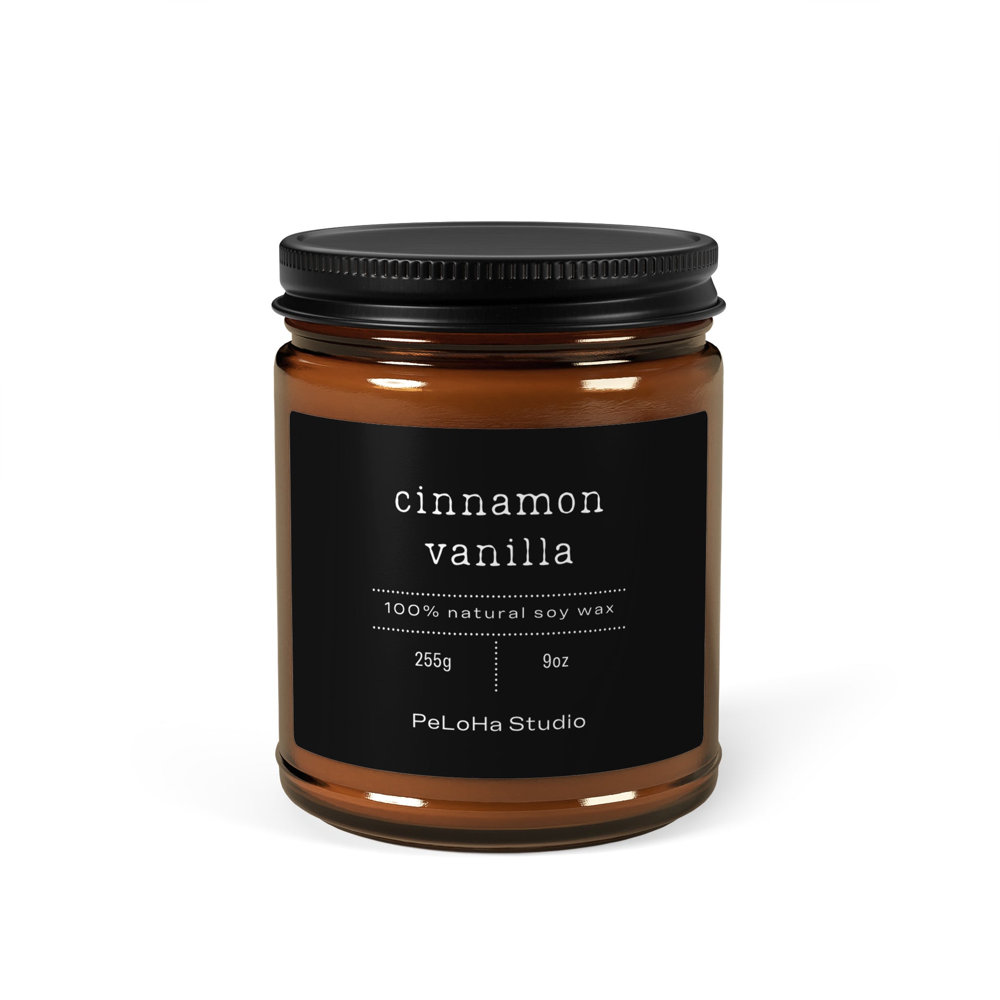An amber glass jar candle with a black lid and a black label reading 'cinnamon vanilla' and 'PeLoHa Studio' on a white background.