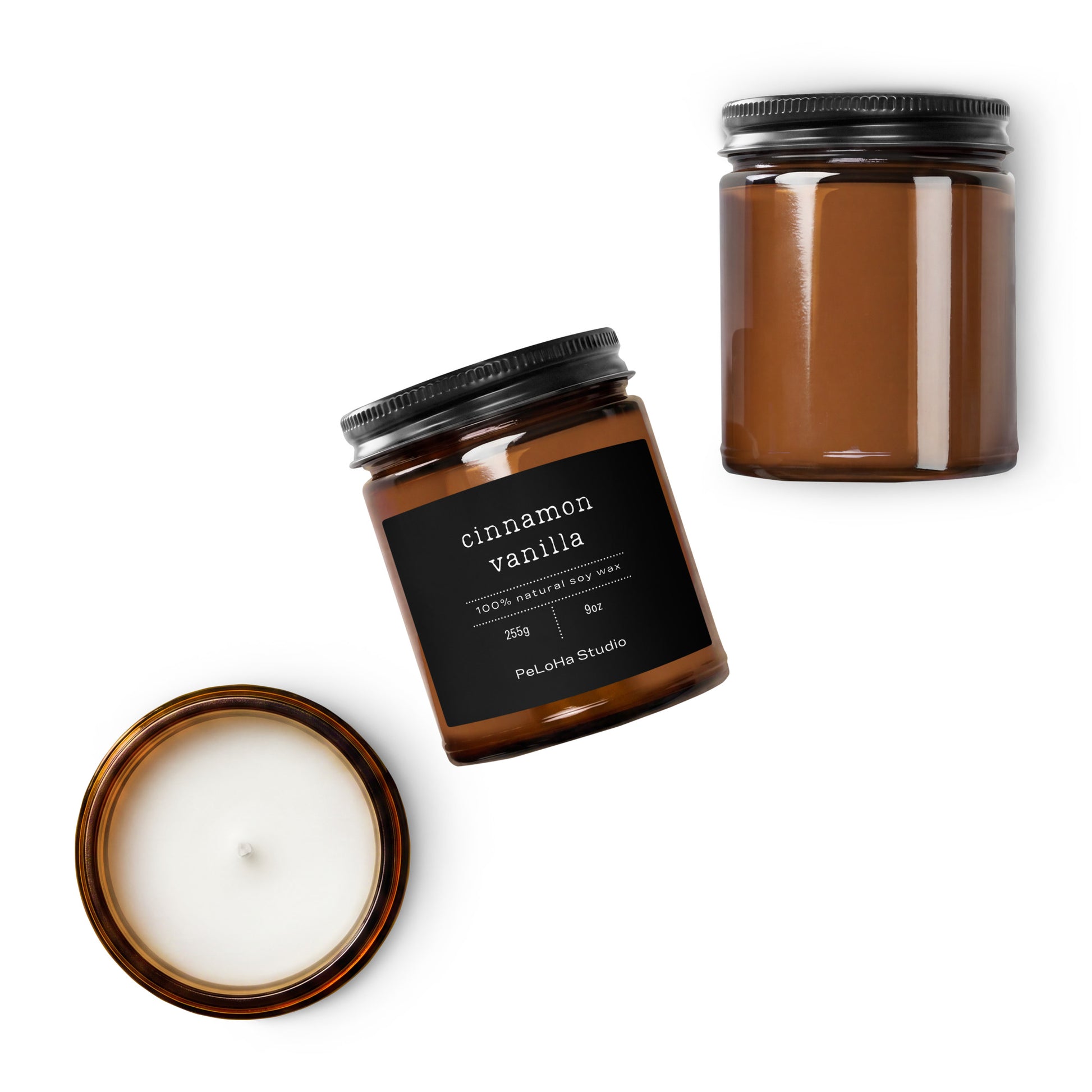 Amber glass jar candle shown in two views on a white background: one with the lid off displaying white wax and one closed with a black label reading 'cinnamon vanilla' and 'PeLoHa Studio.'.