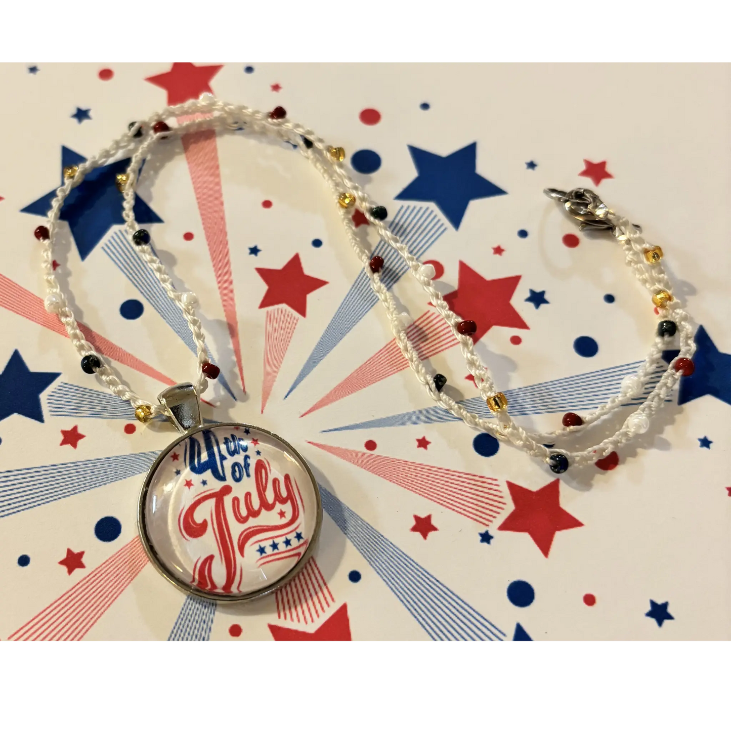 Bead crochet necklace with '4th of July' pendant on a patriotic background