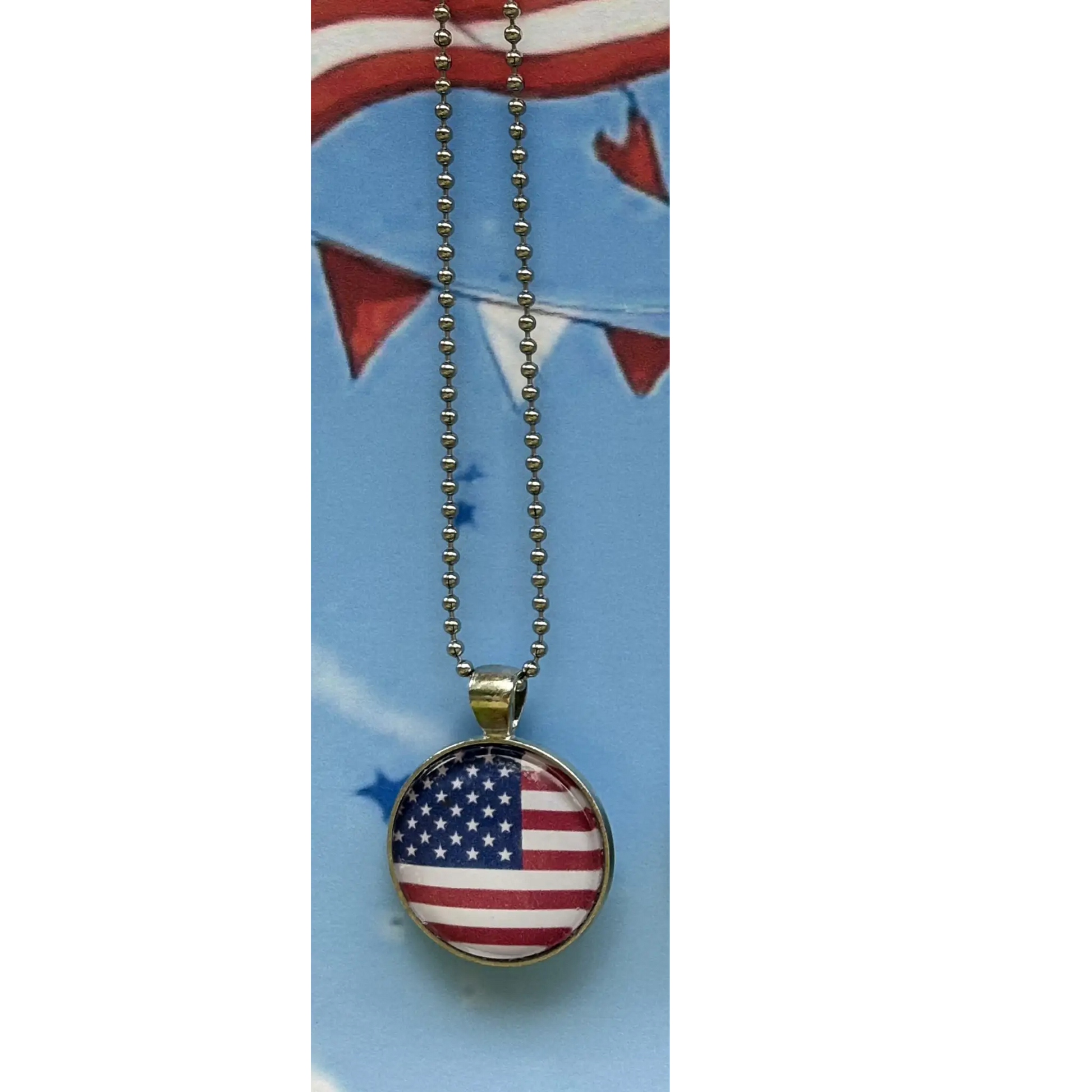 American flag pendant necklace on a blue card with a flag design