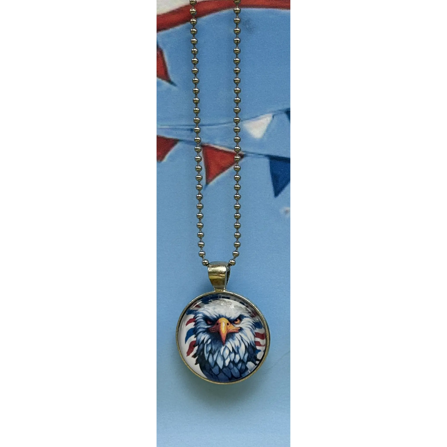 Necklace with an eagle pendant on a blue card