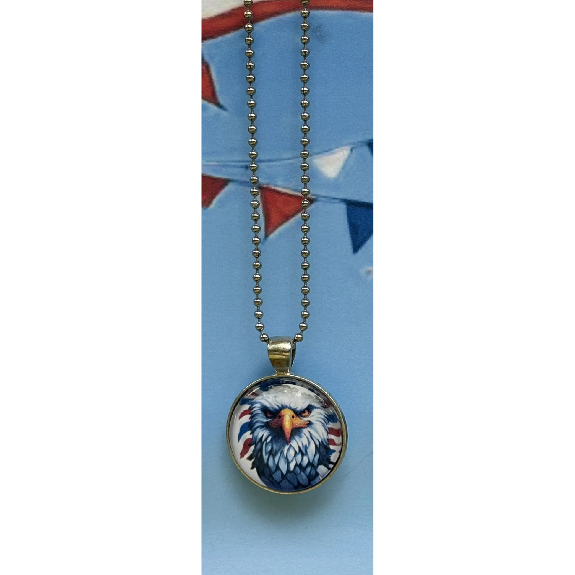 Necklace with an eagle pendant on a blue card
