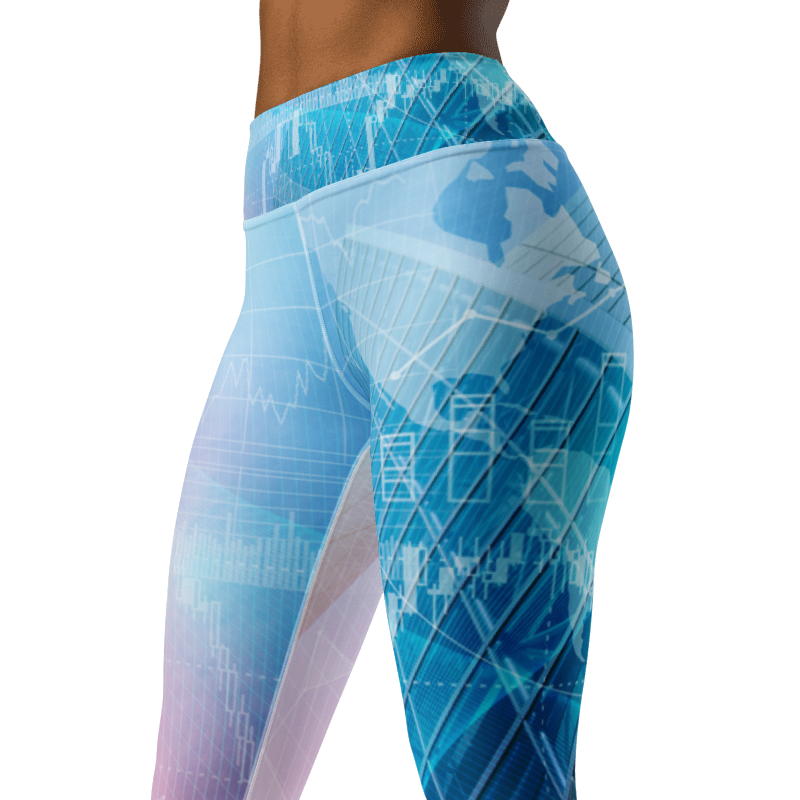 A close-up side view of a person wearing high-waisted leggings with a blue and light blue tech-style print featuring world map graphics, grid lines, and data charts on a white background.