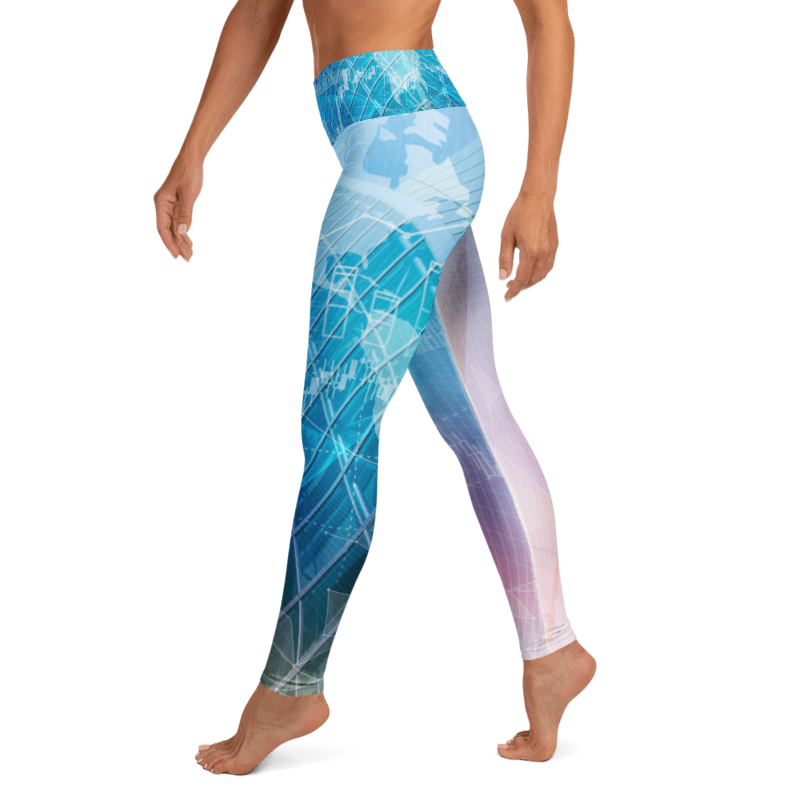 A person wearing high-waisted leggings with a blue, teal, and white geometric globe pattern, shown from the waist down against a plain white background.