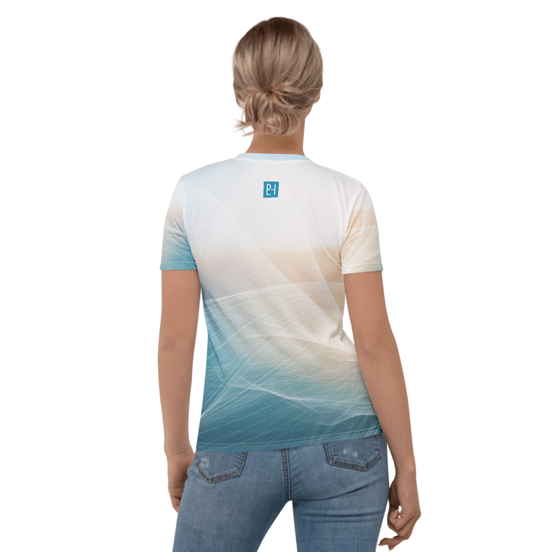 A woman viewed from the back wearing a short-sleeve crew-neck t-shirt with a white-to-blue gradient and abstract wave pattern, paired with blue jeans, against a plain white background.