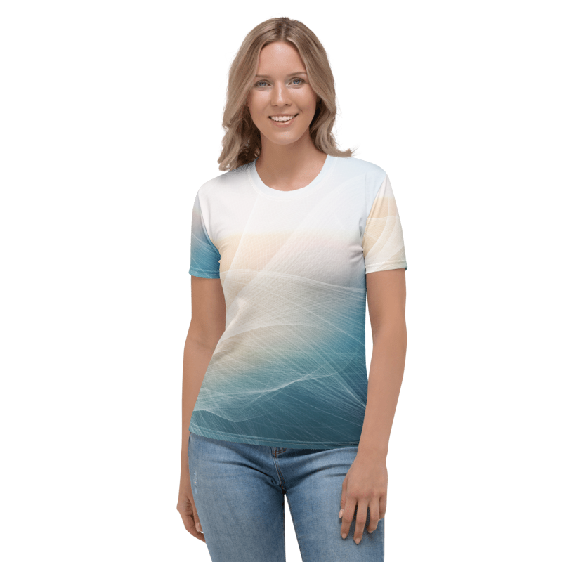 A woman modeling a short-sleeve crewneck t-shirt with a gradient abstract print in shades of teal, blue, and cream, paired with blue jeans against a plain white background.