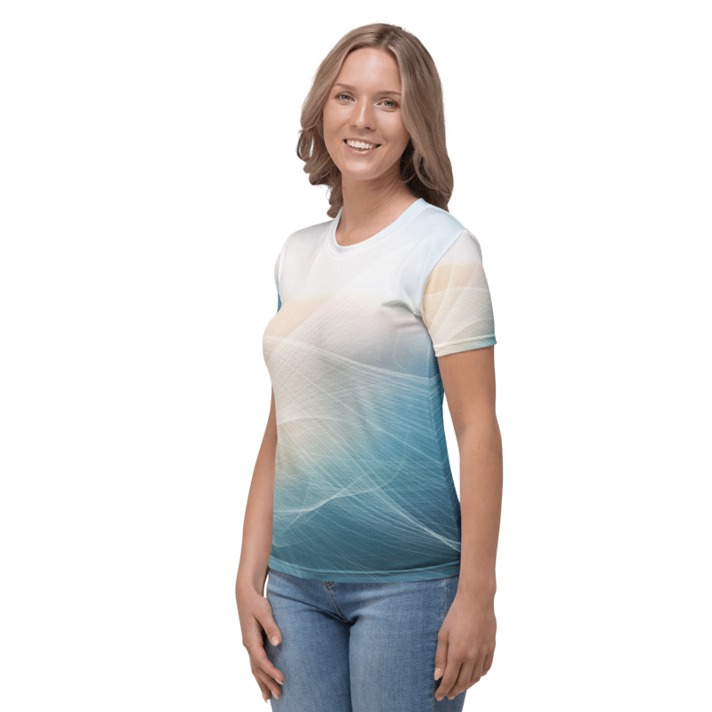 A woman modeling a short-sleeve crewneck t-shirt with a white-to-blue gradient and abstract wave pattern, paired with blue jeans, against a plain white background.
