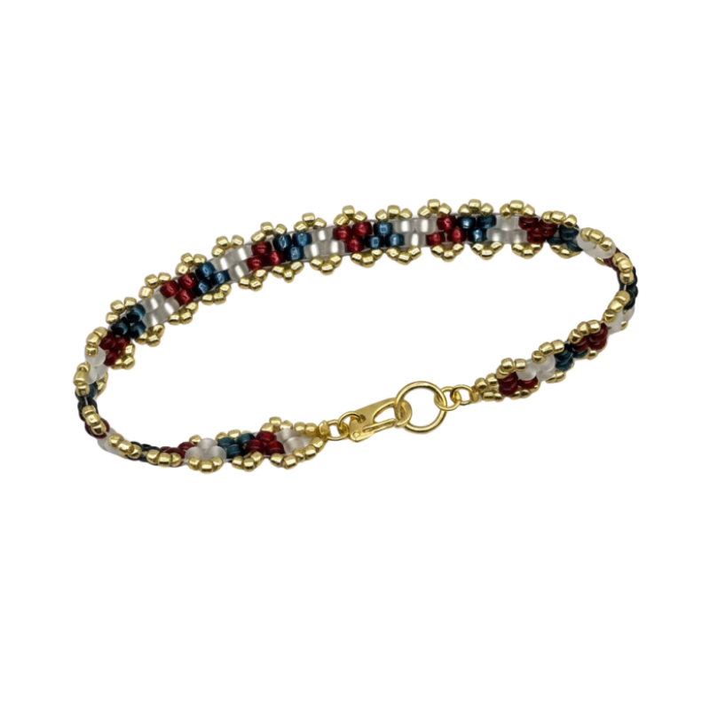 A beaded bracelet with a gold-plated clasp, featuring repeating patterns of gold, white, navy blue, and burgundy red beads, shown on a plain white background.