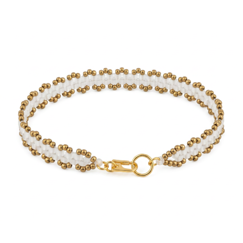 A double-row beaded bracelet featuring white and bronze beads, secured with a gold lobster clasp and ring.