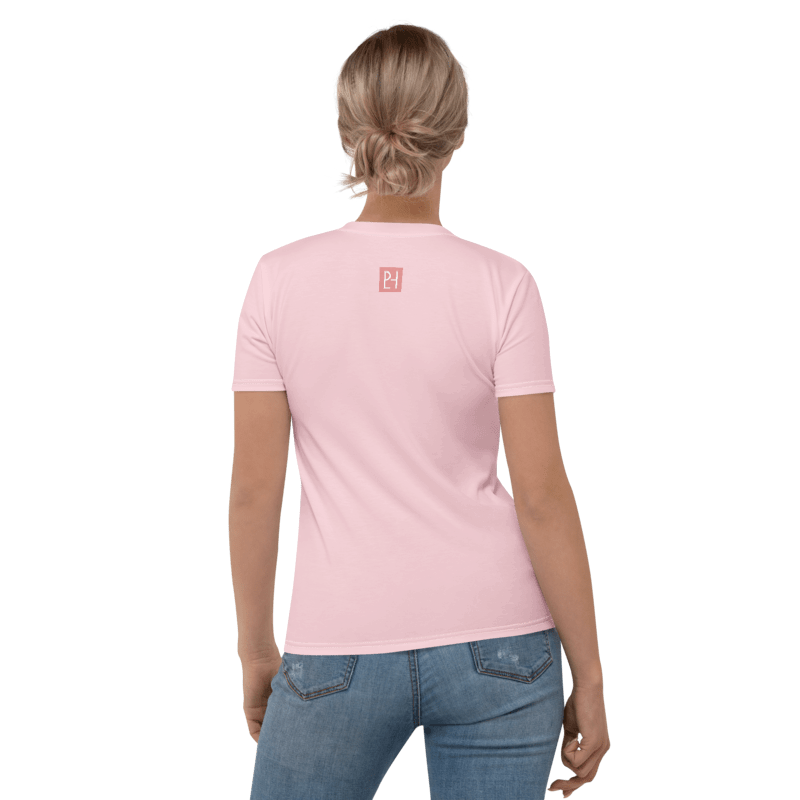 Back view of a woman wearing a light pink jersey t-shirt with a small square PeLoHa Studio logo printed below the collar.